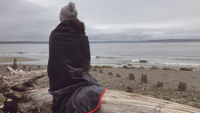 Woman on beach with Alki Blanket
